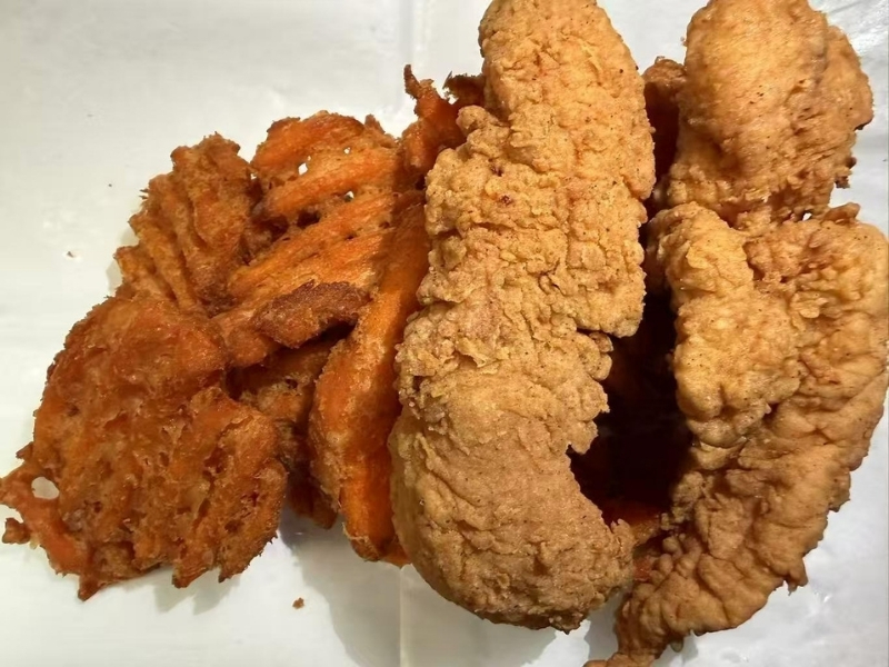 Crispy fried fish served with sweet potato fries at 101 Crab, a Seafood Restaurant in Santa Maria