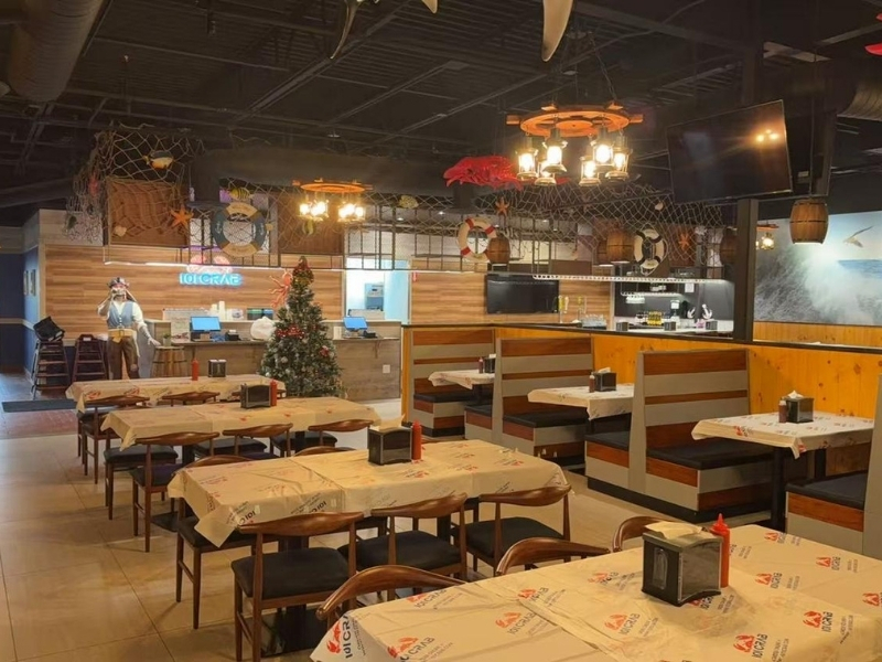 Nautical-themed dining area with tables and decor at 101 Crab, a Seafood Restaurant in Santa Maria