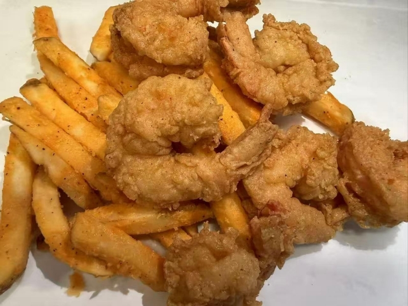 Crispy fried shrimp served with seasoned french fries at 101 Crab, a Seafood Restaurant in Santa Maria