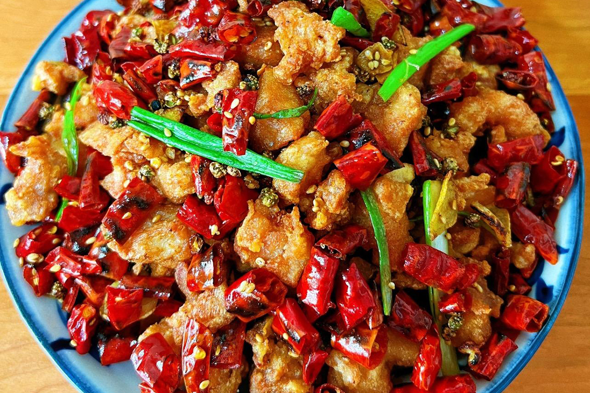 Crispy fried chicken tossed with aromatic chilies, Sichuan peppercorns, and bold Chongqing-style heat at Dim Sum Taste，a Chinese Restaurant in West Chester