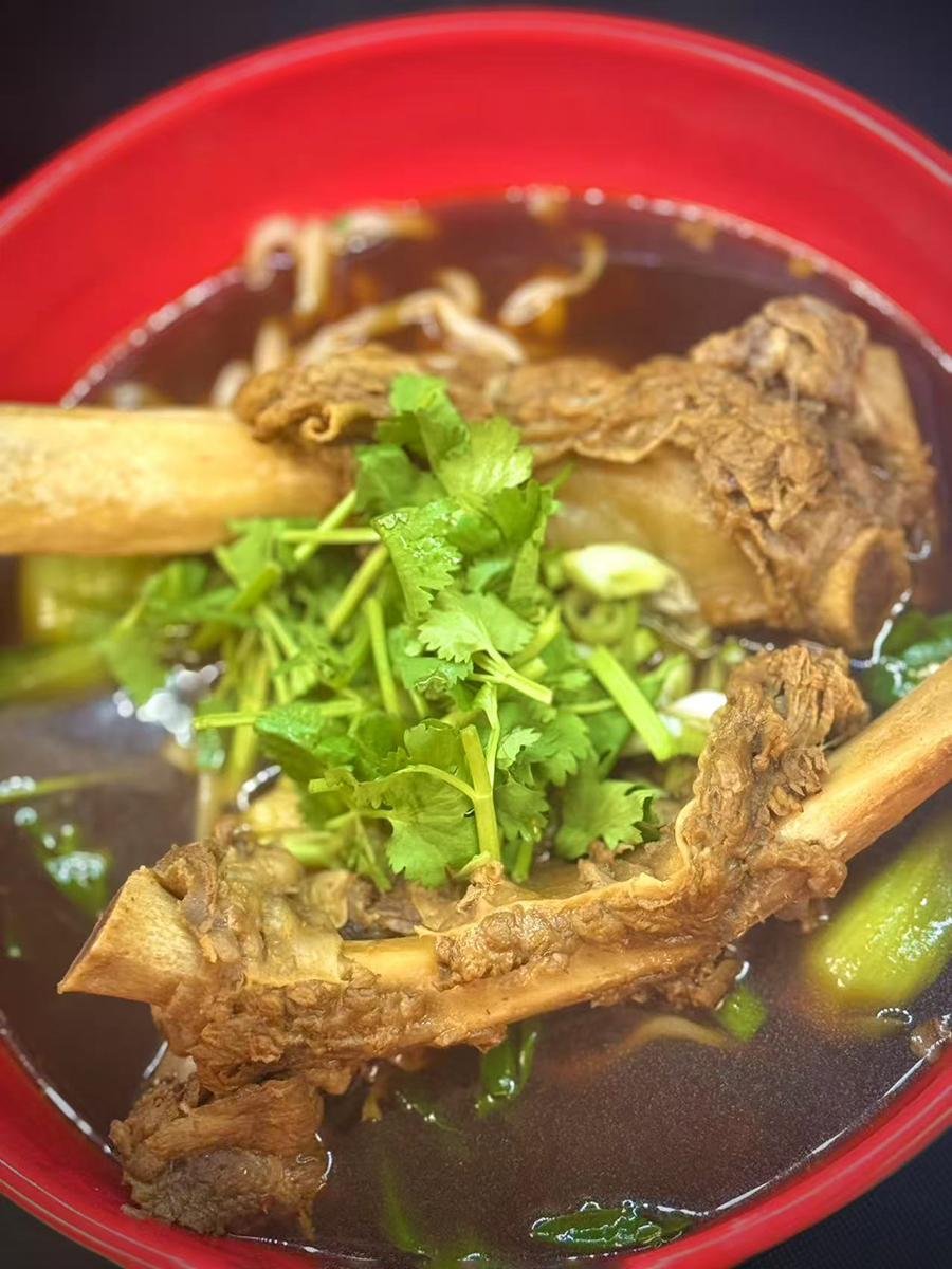 Pork bone soup in a red bowl at 18 Dough，a Chinese Restaurant in Las Vegas