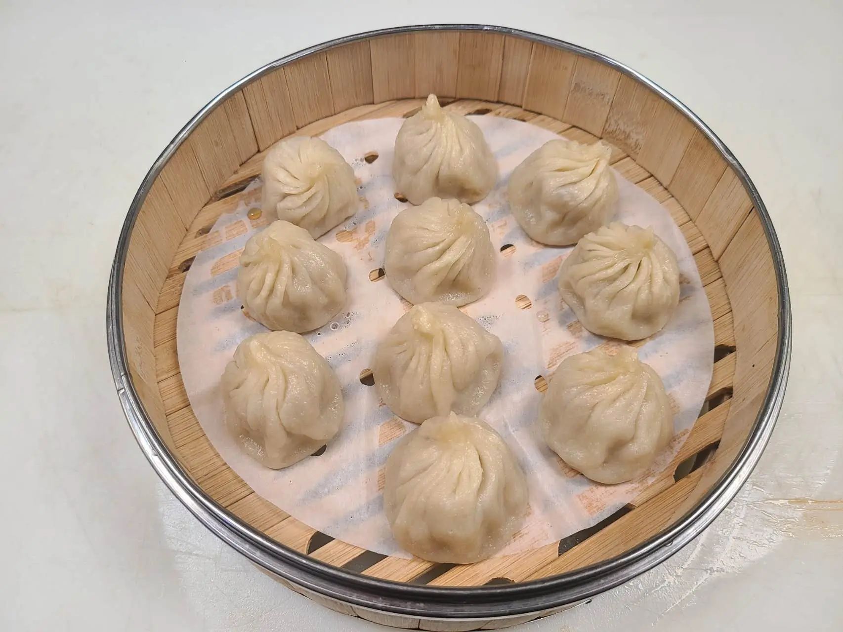Juicy pork soup dumplings steamed in bamboo steamer at 1st Dumpling N Noodle, a Chinese Restaurant in CA