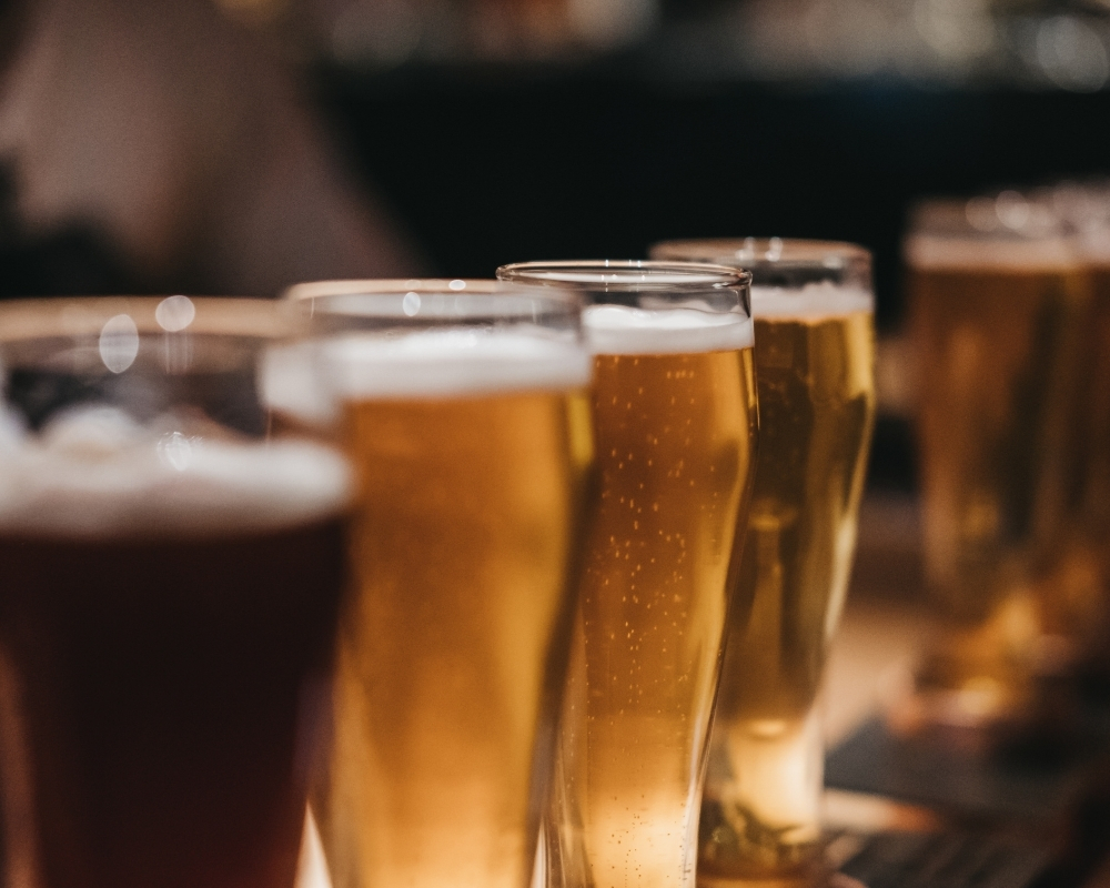Multiple frosty cold beer glasses lined up at 21 Raw Bar Taphouse & Grill，a Seafood Restaurant in Greenville