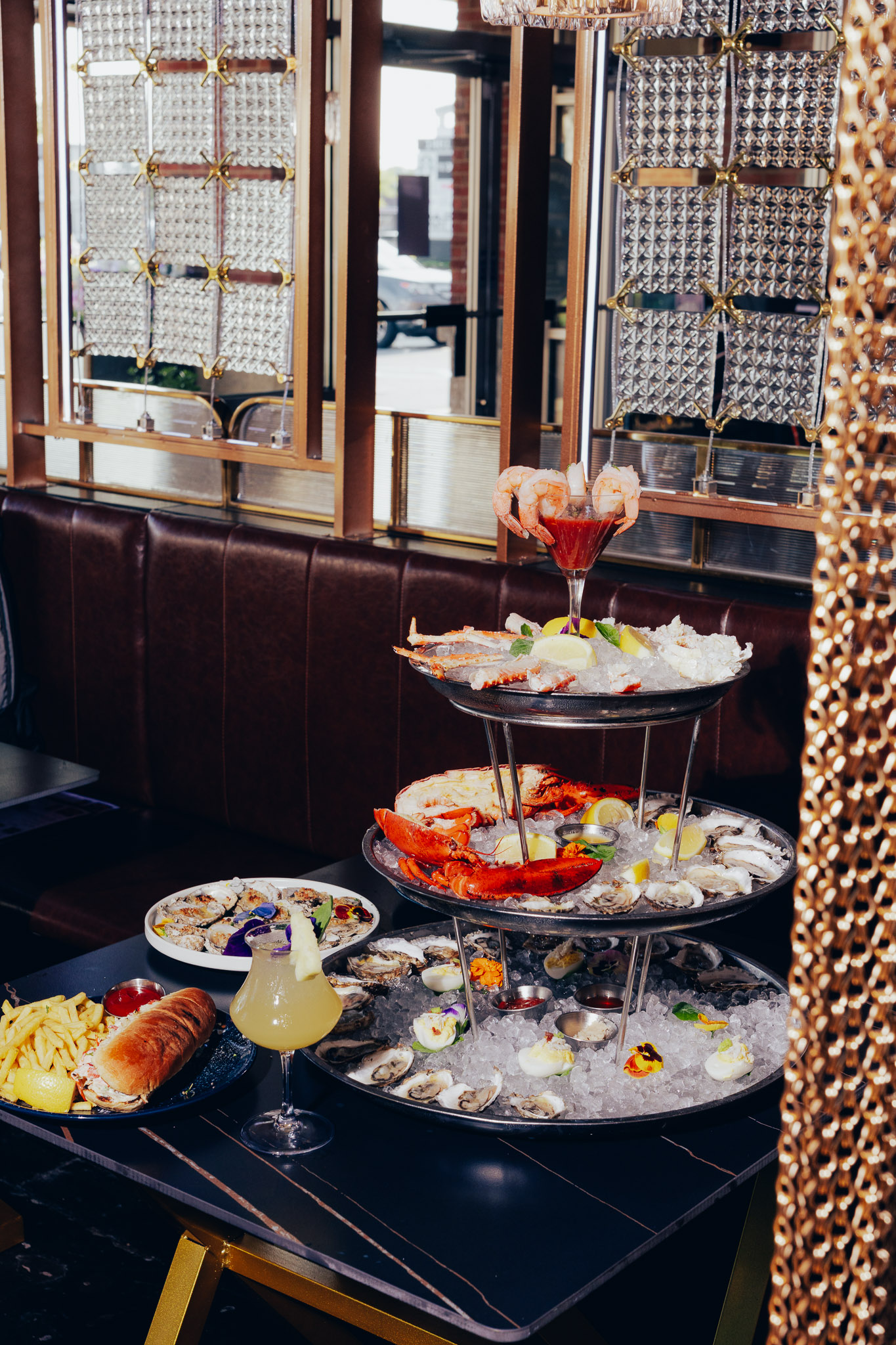 Large chilled seafood tower with lobster and oysters