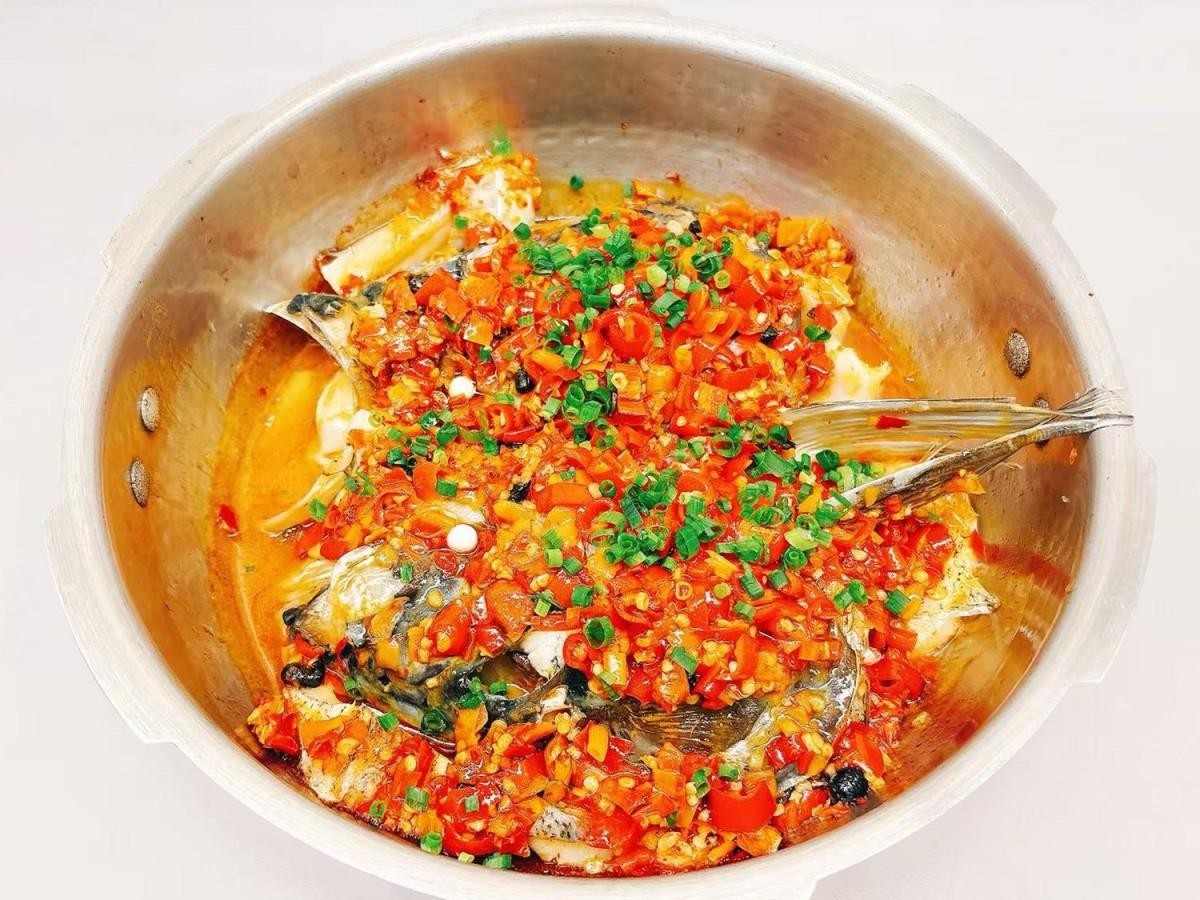 Fish head cooked in a pressure cooker with chili at 28° North Old Changsha, a Chinese Restaurant in Rowland Heights.