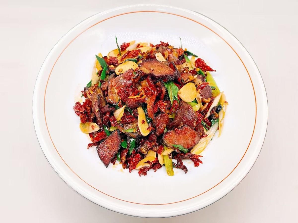 Cured beef brisket stir - fried with garlic leaves at 28° North Old Changsha, a Chinese Restaurant in Rowland Heights.
