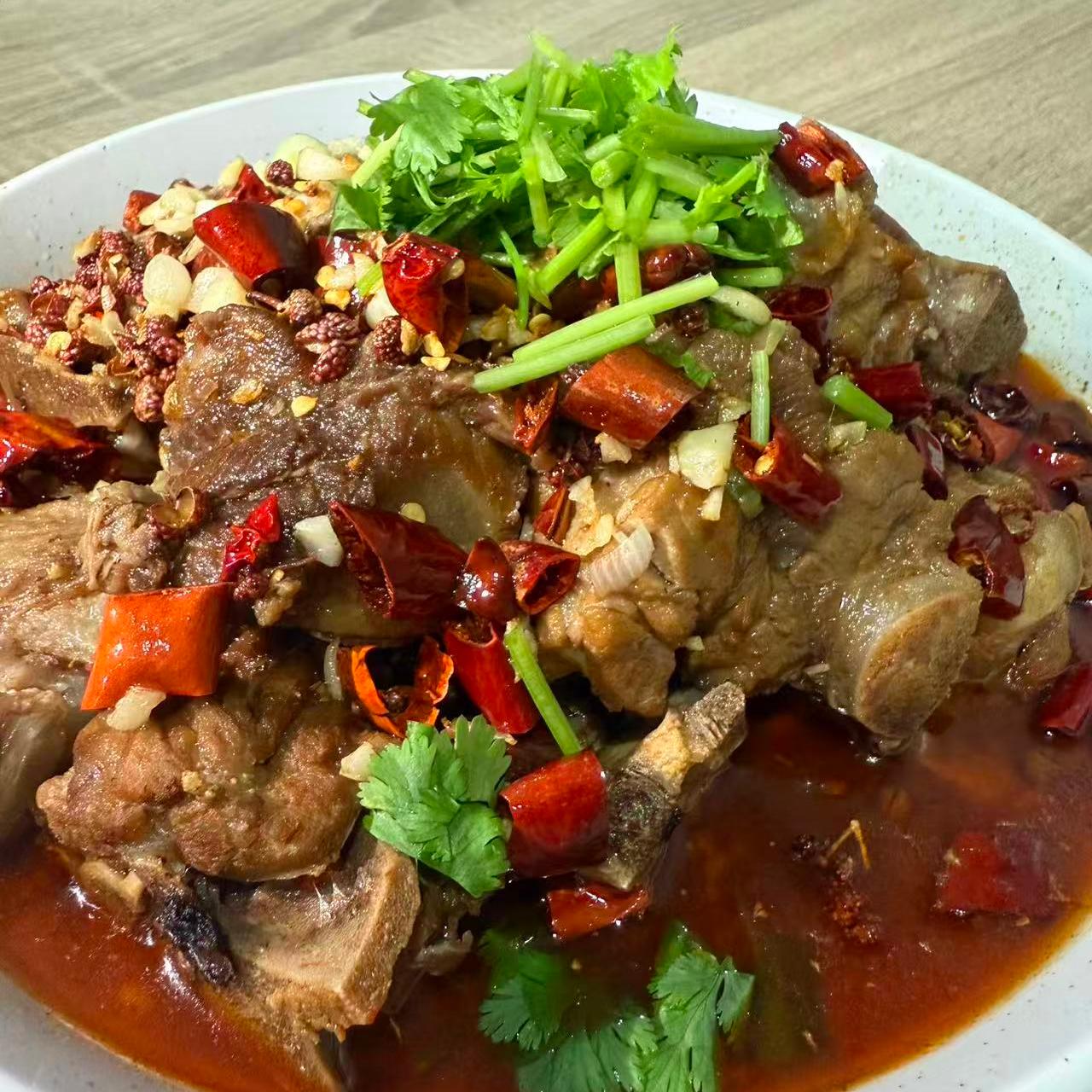 Spicy pork ribs garnished with cilantro at 3 He Noodles, a Chinese Restaurant in Temple City