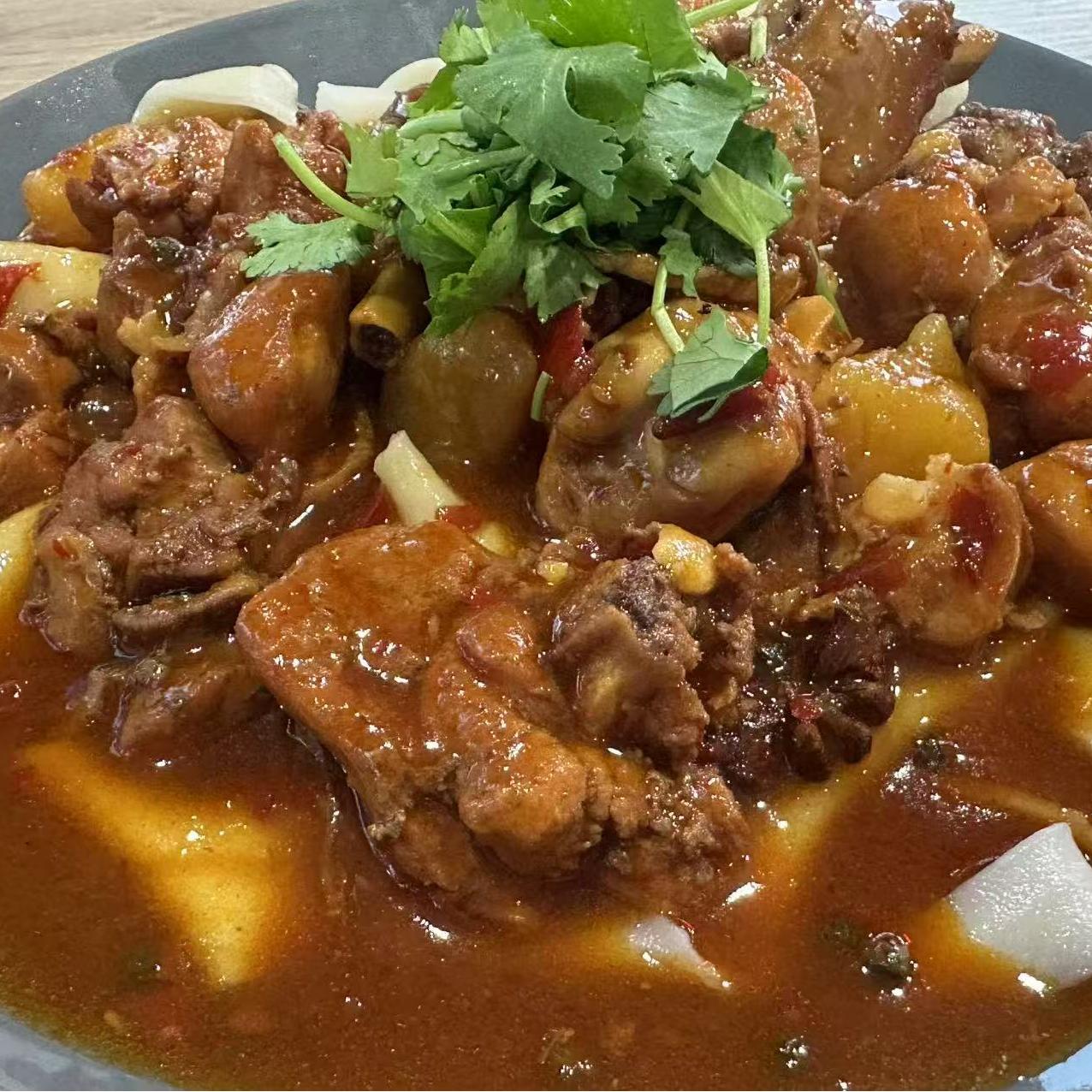 Spicy chicken stew served with noodles at 3 He Noodles, a Chinese Restaurant in Temple City