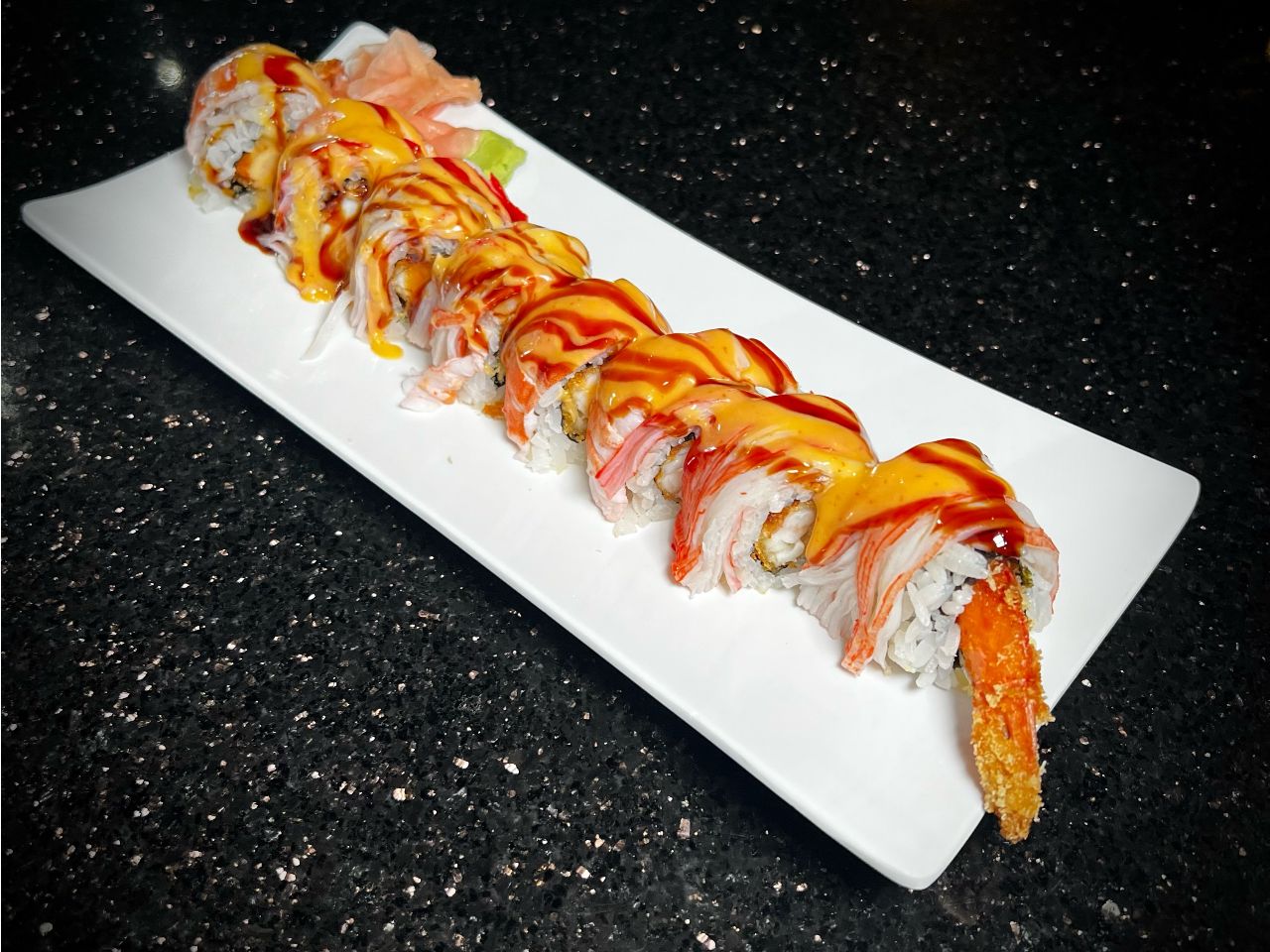 Crazy shrimp sushi roll topped with sauce and crispy shrimp pieces at 592 Korean BBQ, an Asian Fusion Restaurant in Appleton