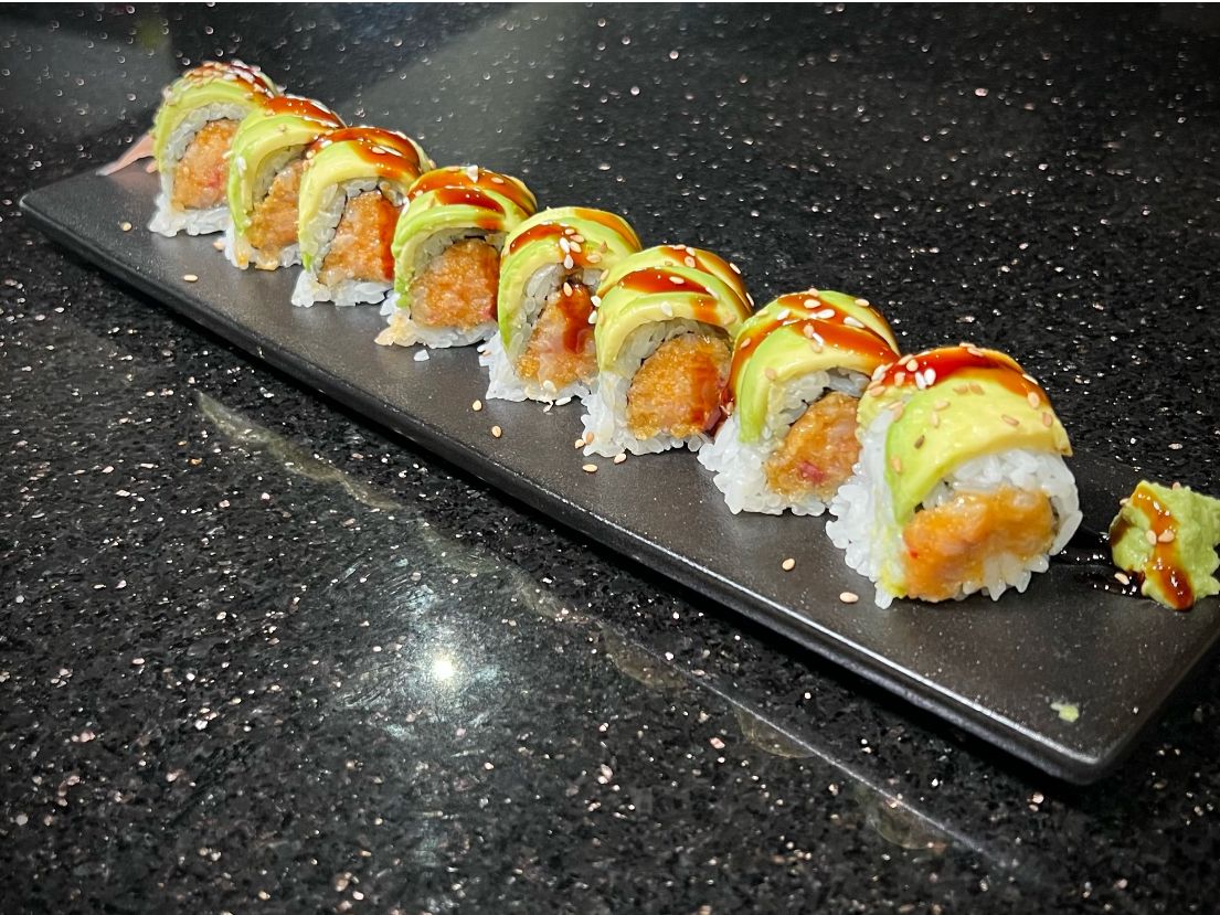 Green Turtle sushi roll layered with fresh avocado and colorful fish at 592 Korean BBQ, an Asian Fusion Restaurant in Appleton