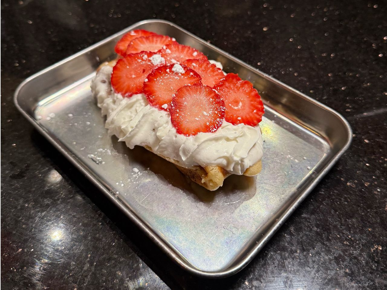 Sweet strawberry croffle topped with cream and fresh strawberry slices at 592 Korean BBQ, an Asian Fusion Restaurant in Appleton