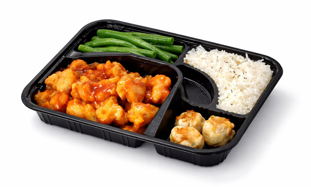 Black takeout bento with orange chicken rice green beans shumai at 5PM MOMENTS, an Asian Fusion Bento restaurant in New Port Richry