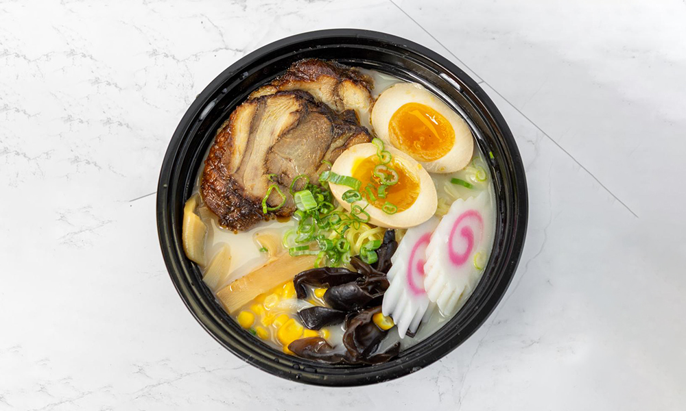 Rich tonkotsu ramen with chashu pork and soft-boiled egg at 5PM MOMENTS, an Asian Fusion Bento restaurant in New Port Richry