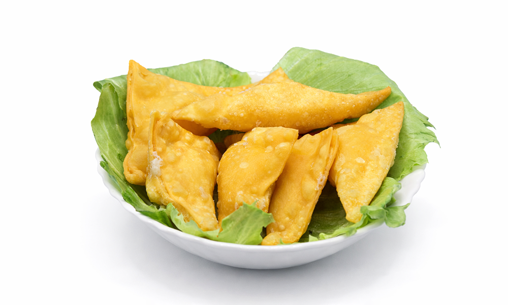 Golden fried wontons served on fresh lettuce at 5PM MOMENTS, an Asian Fusion Bento restaurant in New Port Richry
