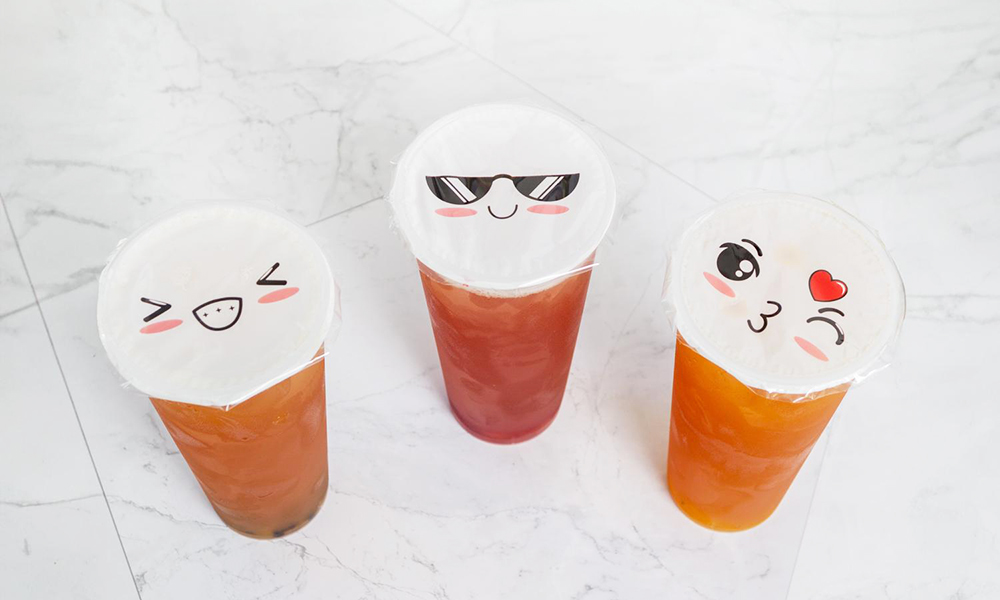 Iced fruit teas with cute emoji lids at 5PM MOMENTS, an Asian Fusion Bento restaurant in New Port Richry