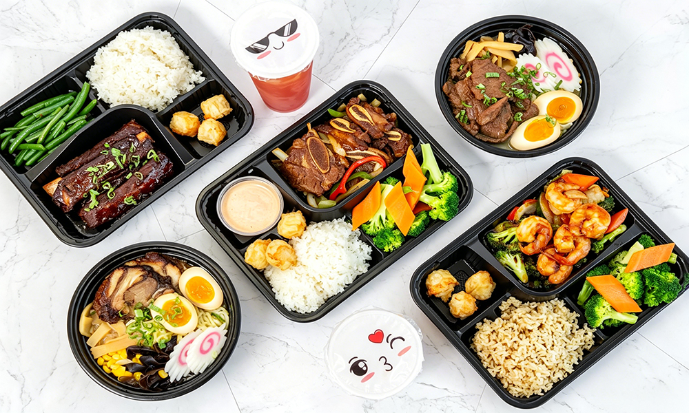 Assorted Asian fusion bento meals with rice and sides at 5PM MOMENTS, an Asian Fusion Bento restaurant in New Port Richry