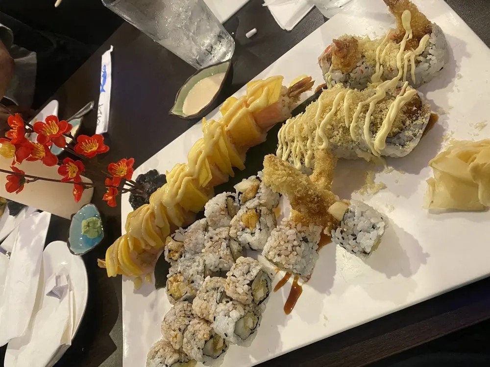 Variety of sushi rolls with sauces at E Sushi & Grill, a Japanese Restaurant in Apollo Beach