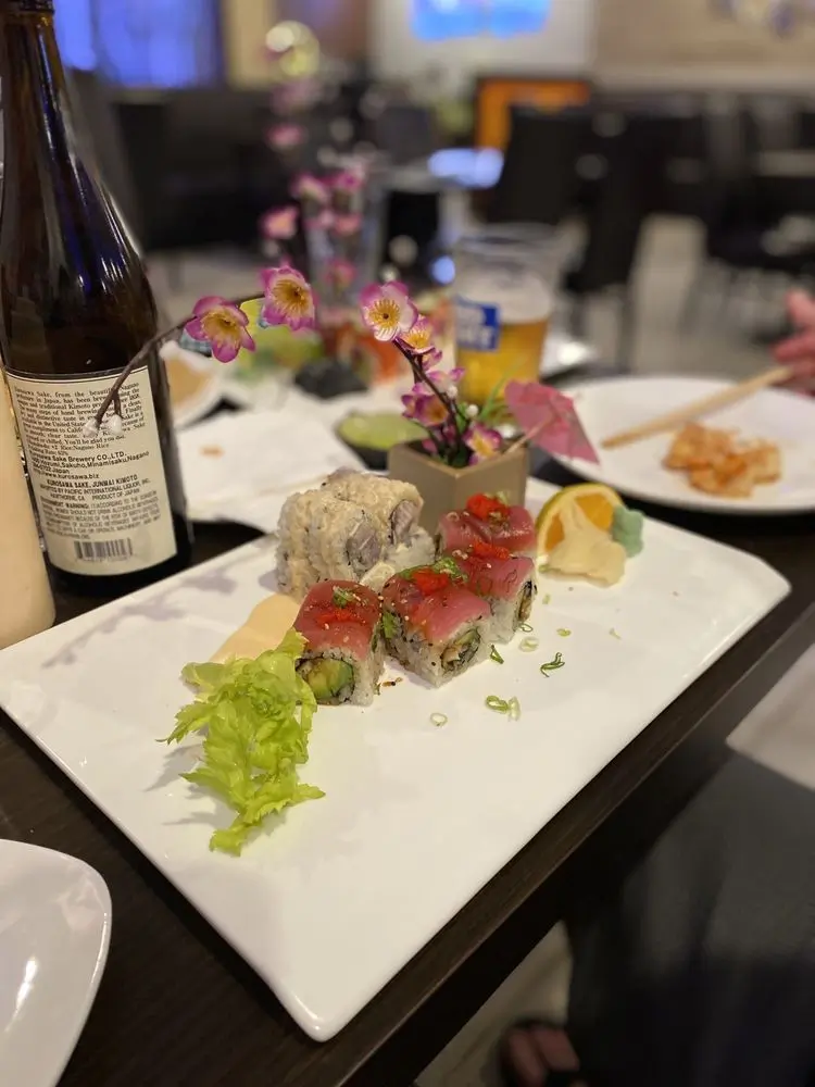 Garnished sushi rolls with decorative glass at E Sushi & Grill, a Japanese Restaurant in Apollo Beach
