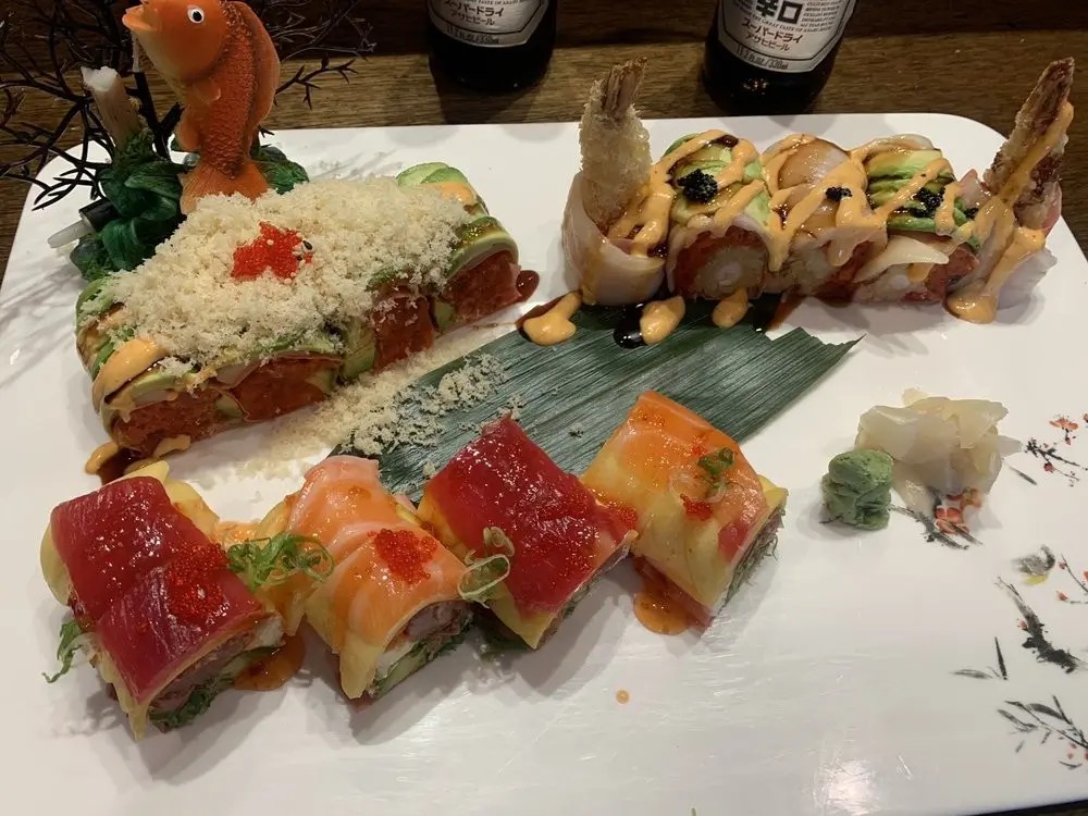 Garnished sushi rolls with sauces at E Sushi & Grill, a Japanese Restaurant in Apollo Beach