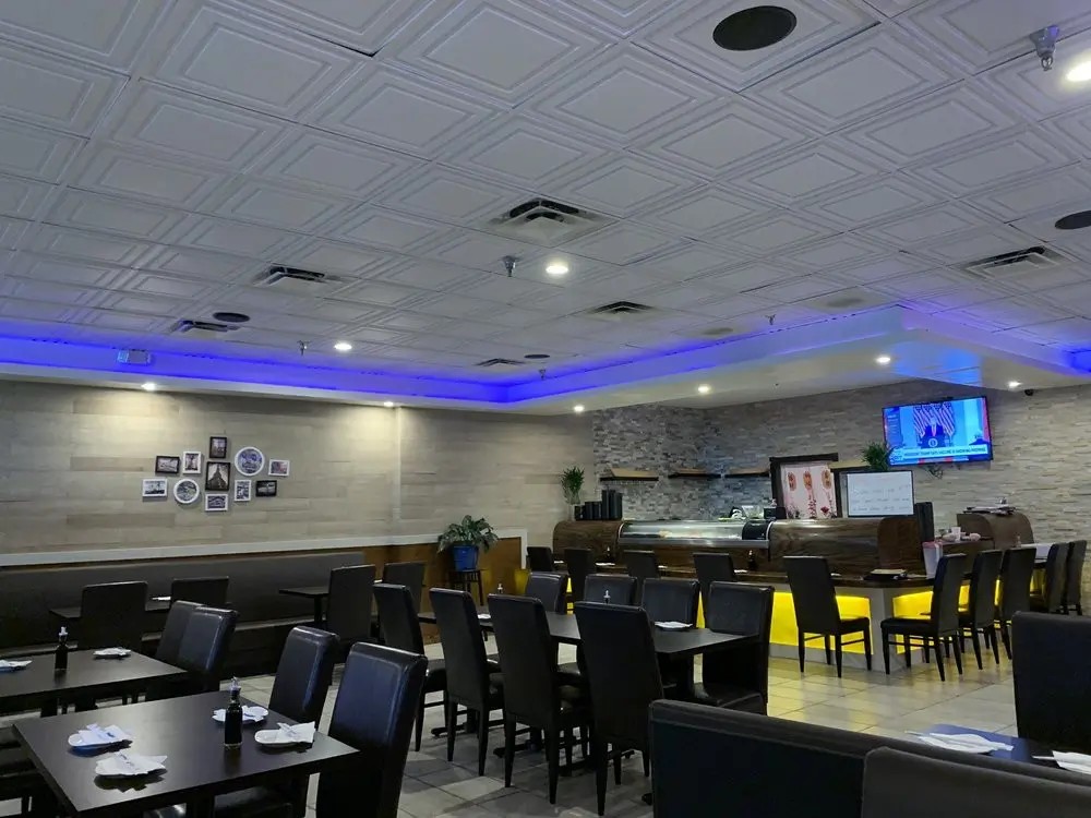 Dining area with sushi bar and TV at E Sushi & Grill, a Japanese Restaurant in Apollo Beach