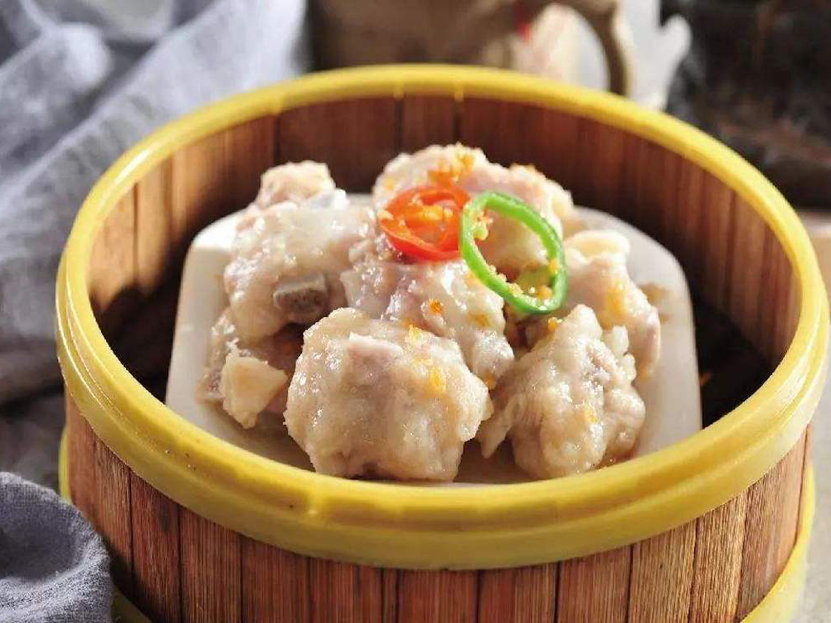 Steamed Pork Ribs in a bamboo steamer, tender and flavorful at Seven Folding Dumpling House，a Chinese Restaurant in Mission Viejo