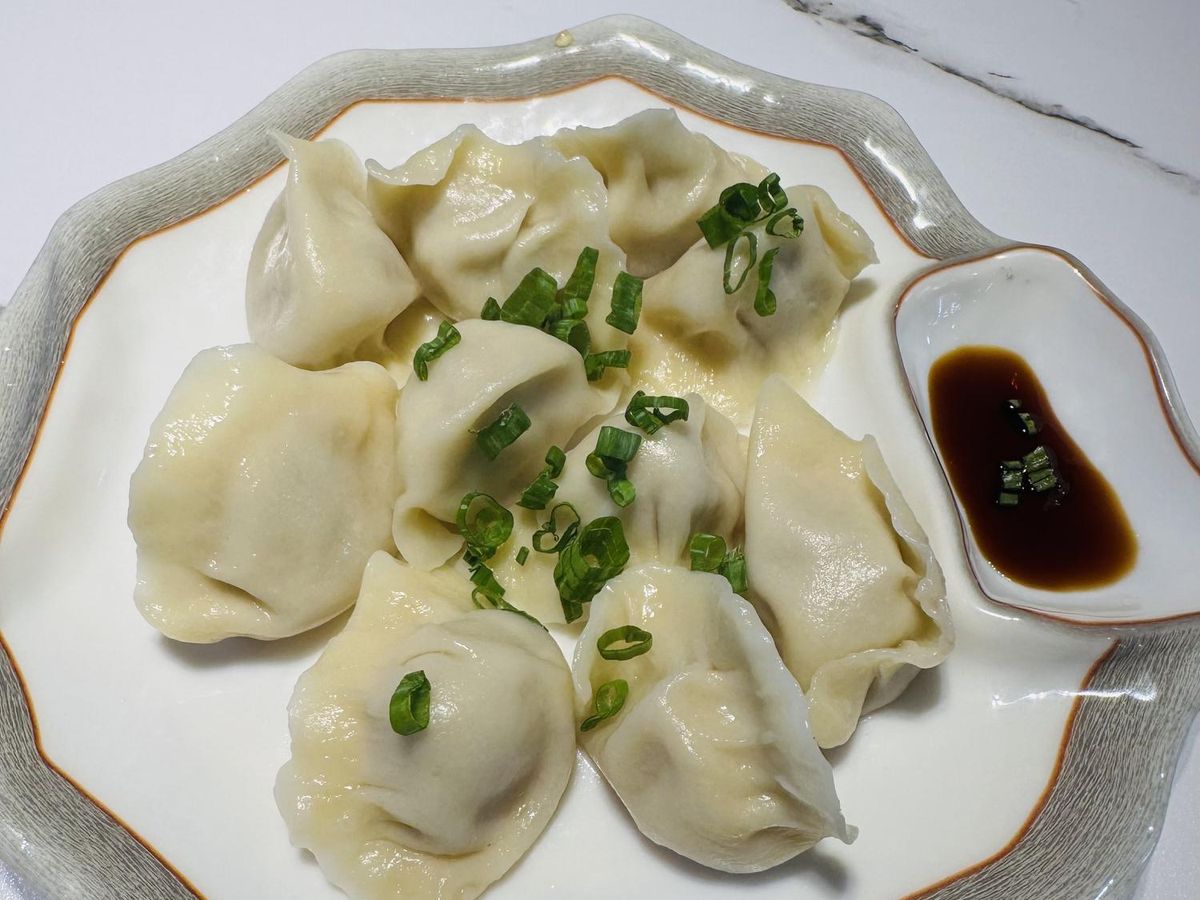 Dumplings with dipping sauce from Seven Folding Dumpling House, a Chinese restaurant in Mission Viejo