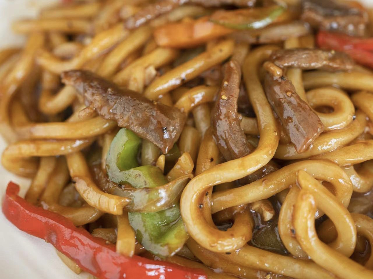 Black Pepper Stir - fried Udon Noodles with beef and vegetables, a flavorful noodle dish at Seven Folding Dumpling House，a Chinese Restaurant in Mission Viejo
