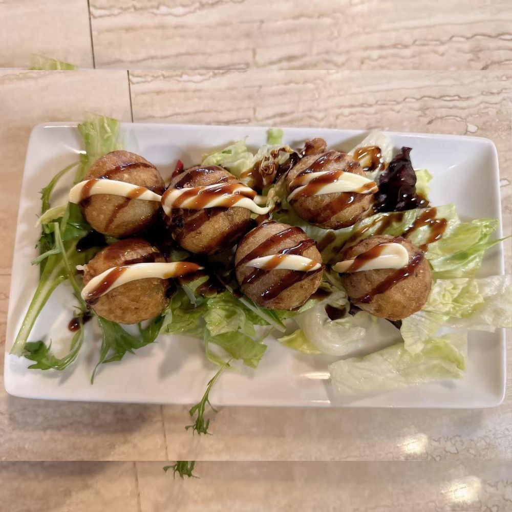 85-Asian-Fusion-Asian-Restaurant-Takoyaki-Choctaw Takoyaki with sauces on lettuce at 85 Asian Fusion, a Asian Restaurant in Choctaw.