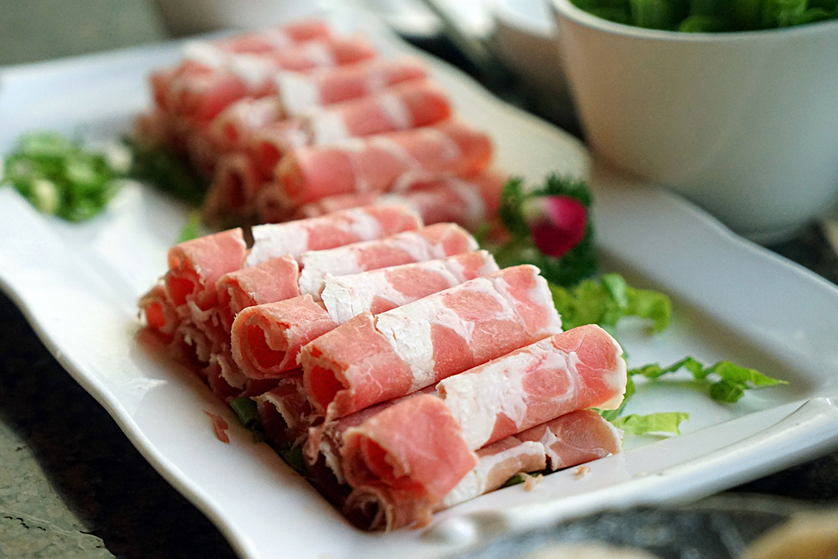 88-Korean-BBQ-and-Hot-Pot-Asian-Fusion-Restaurant-Lamb-Slices-Frisco neatly rolled fresh lamb ready for hot pot at 88 Korean BBQ and Hot Pot,a Asian Fusion Restaurant in Frisco