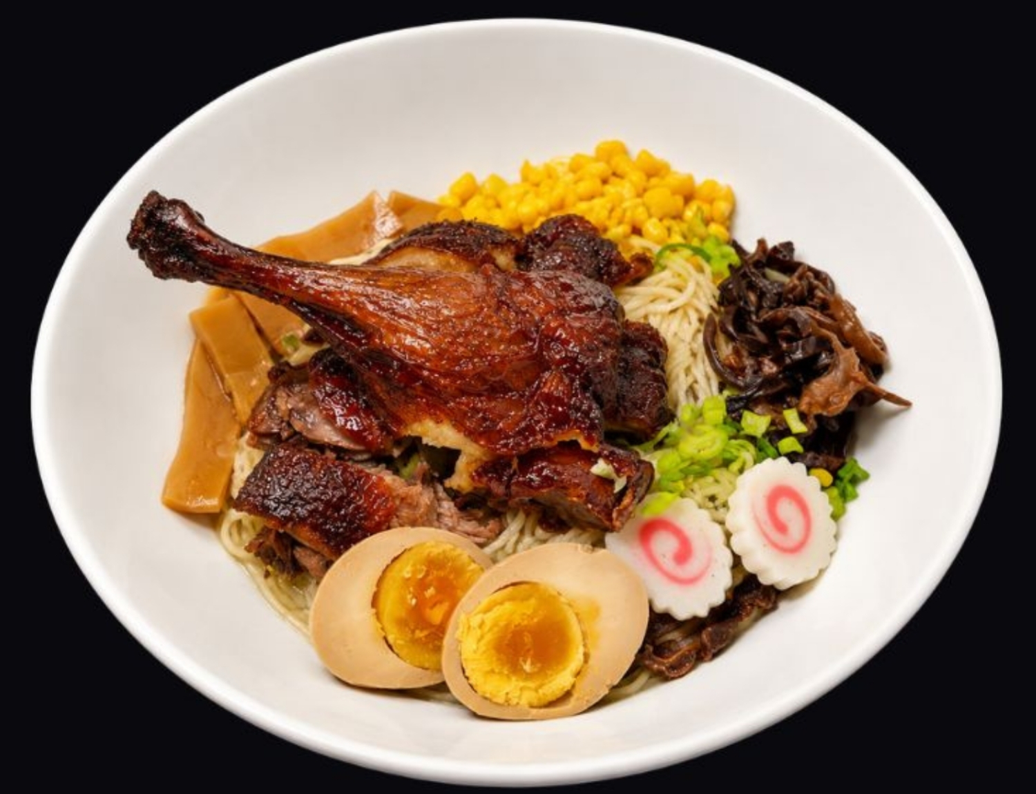 Roast duck noodle bowl with egg, corn and mushrooms