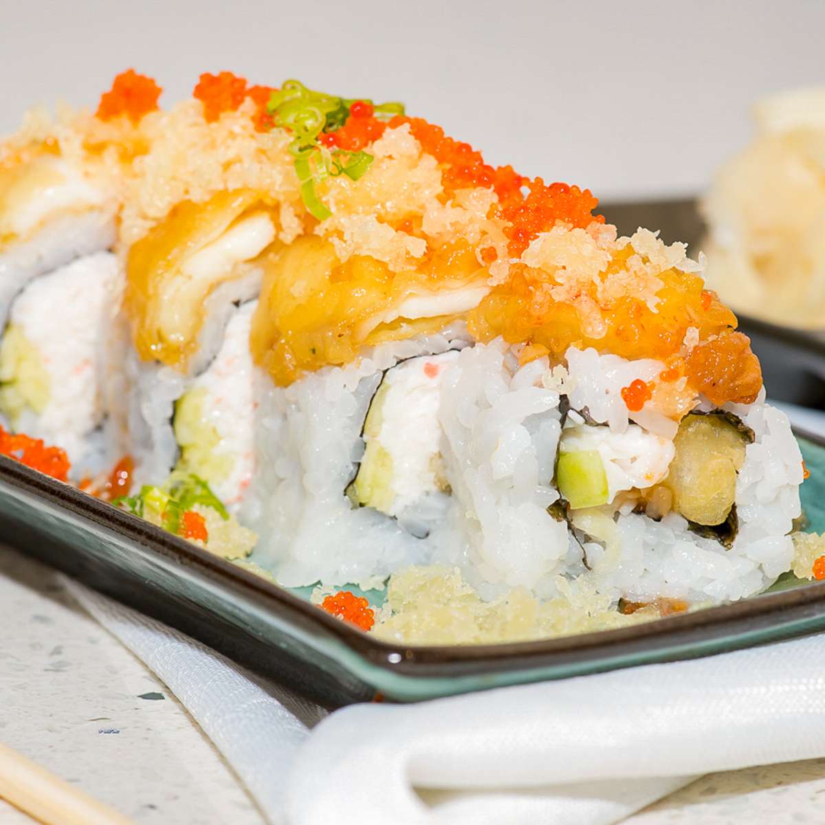 Tempura sushi roll with fish roe toppings at Aji Sushi, an Sushi Restaurant in Sacramento