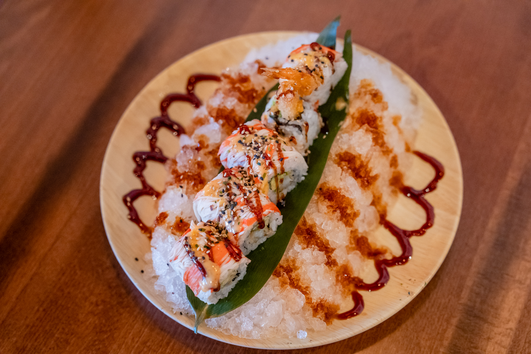 Chilled crab rolls on ice with sauces at Aji Izakaya Cypress, a Japanese Restaurant in Cypress