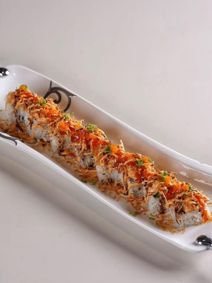 Crispy sushi roll topped with fish roe, crispy flakes and sauces at AJI Koharu Sushi & Grill, a Sushi Restaurant in Federal Way