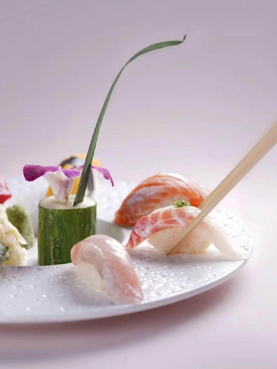 Elegant nigiri sushi with fresh fish and decorative garnish at AJI Koharu Sushi & Grill, a Sushi Restaurant in Federal Way