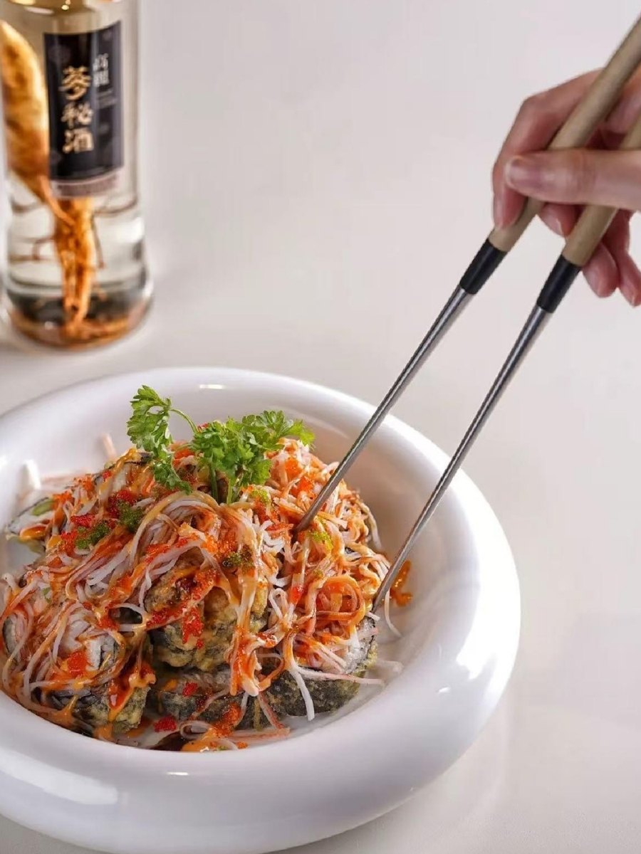 Stacked sushi bowl with crispy toppings, fish roe and creamy sauce at AJI Koharu Sushi & Grill, a Sushi Restaurant in Federal Way