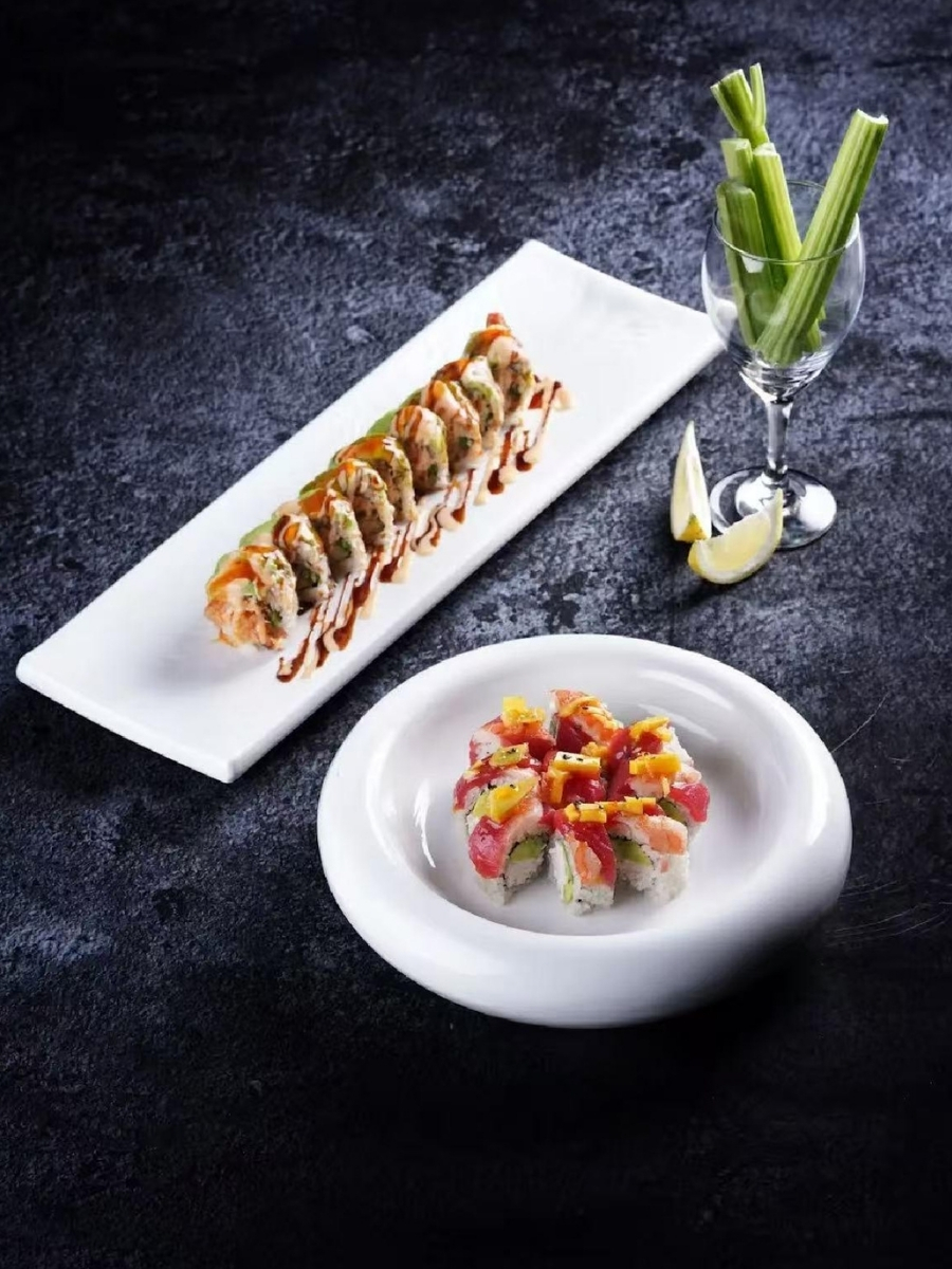 Two styles of sushi rolls with elegant plating at AJI Koharu Sushi & Grill, a Sushi Restaurant in Federal Way