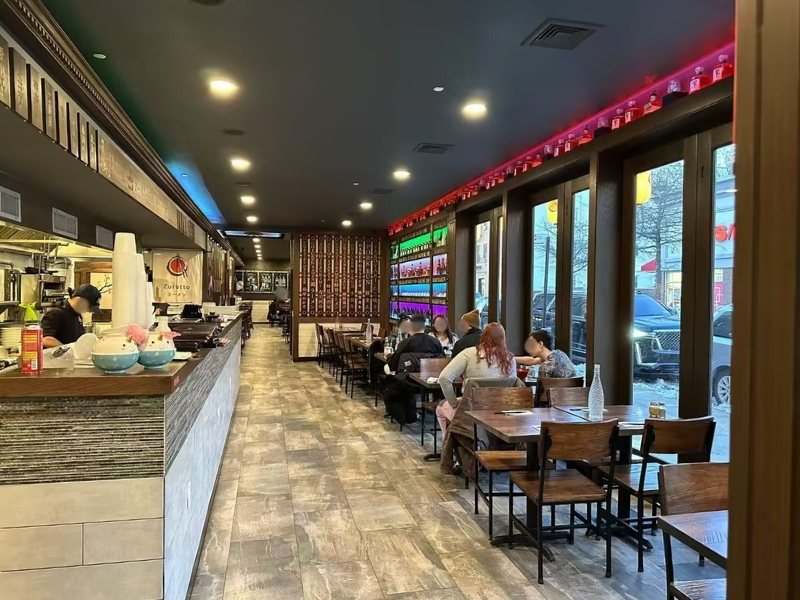 Occupied dining area with patrons at Ajimi, a Ramen Restaurant in Brooklyn