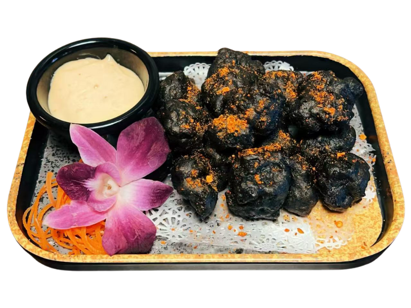 Black Karaage Chicken with sauce at Aji Ramen, a Ramen Restaurant in Albuquerque