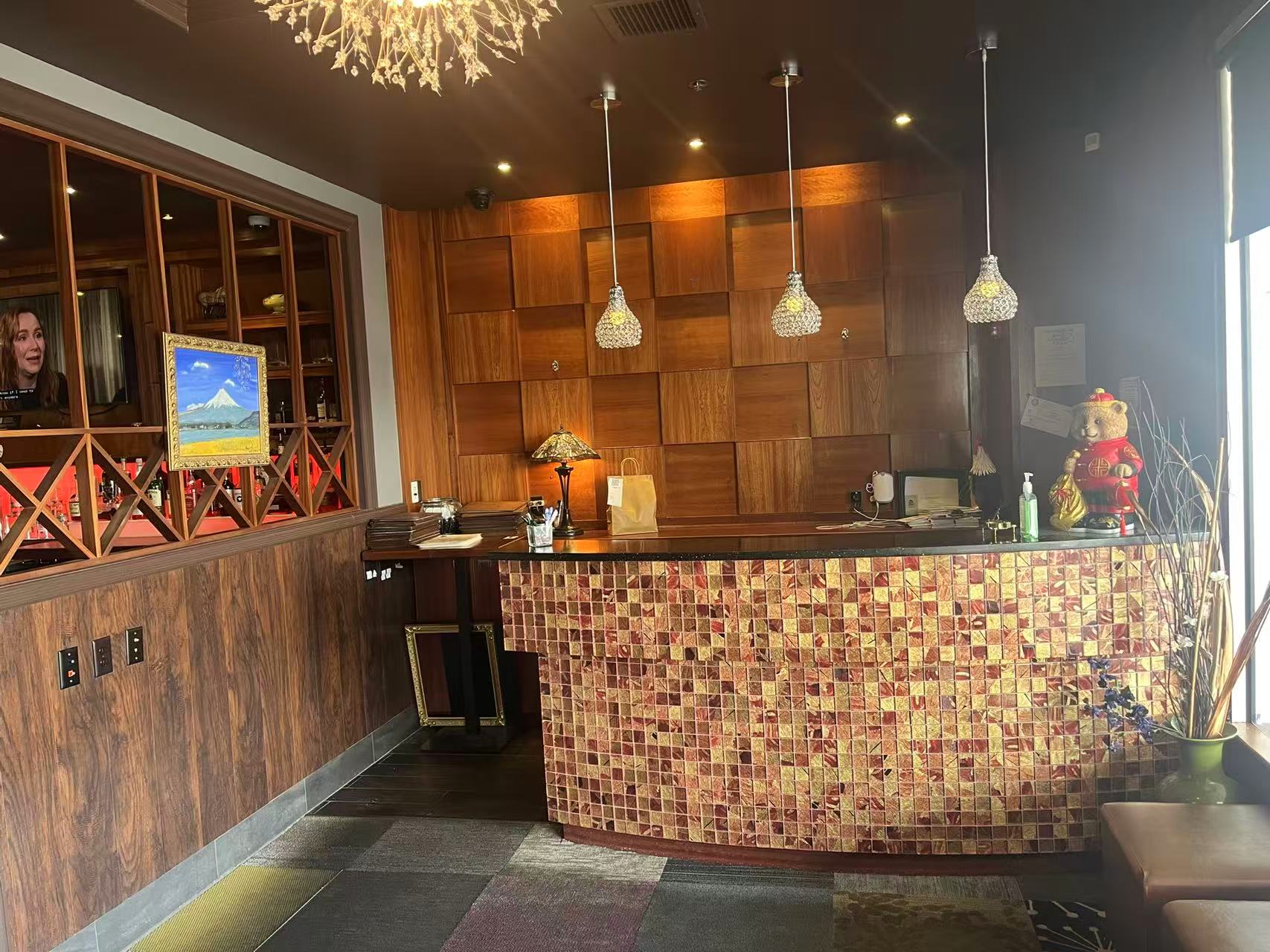 Reception desk with mosaic decor at AJ Hibachi Steakhouse, an Asian Restaurant in Cheshire