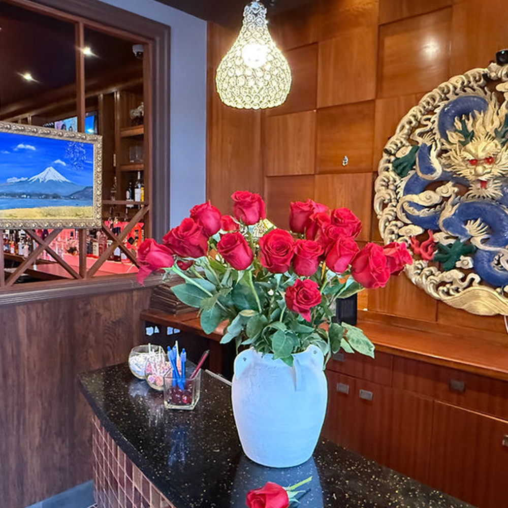 Desk with Red Roses & Decor at AJ Hibachi Steakhouse, an Asian Restaurant in Cheshire