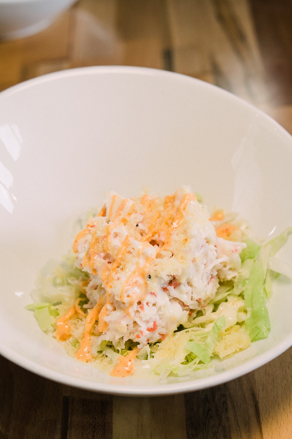 Crab salad with lettuce and spicy creamy sauce