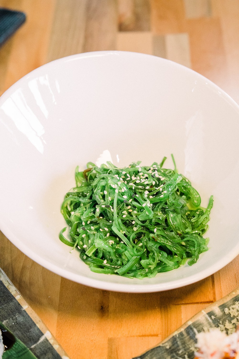 Seasoned seaweed salad sprinkled with white sesame seeds