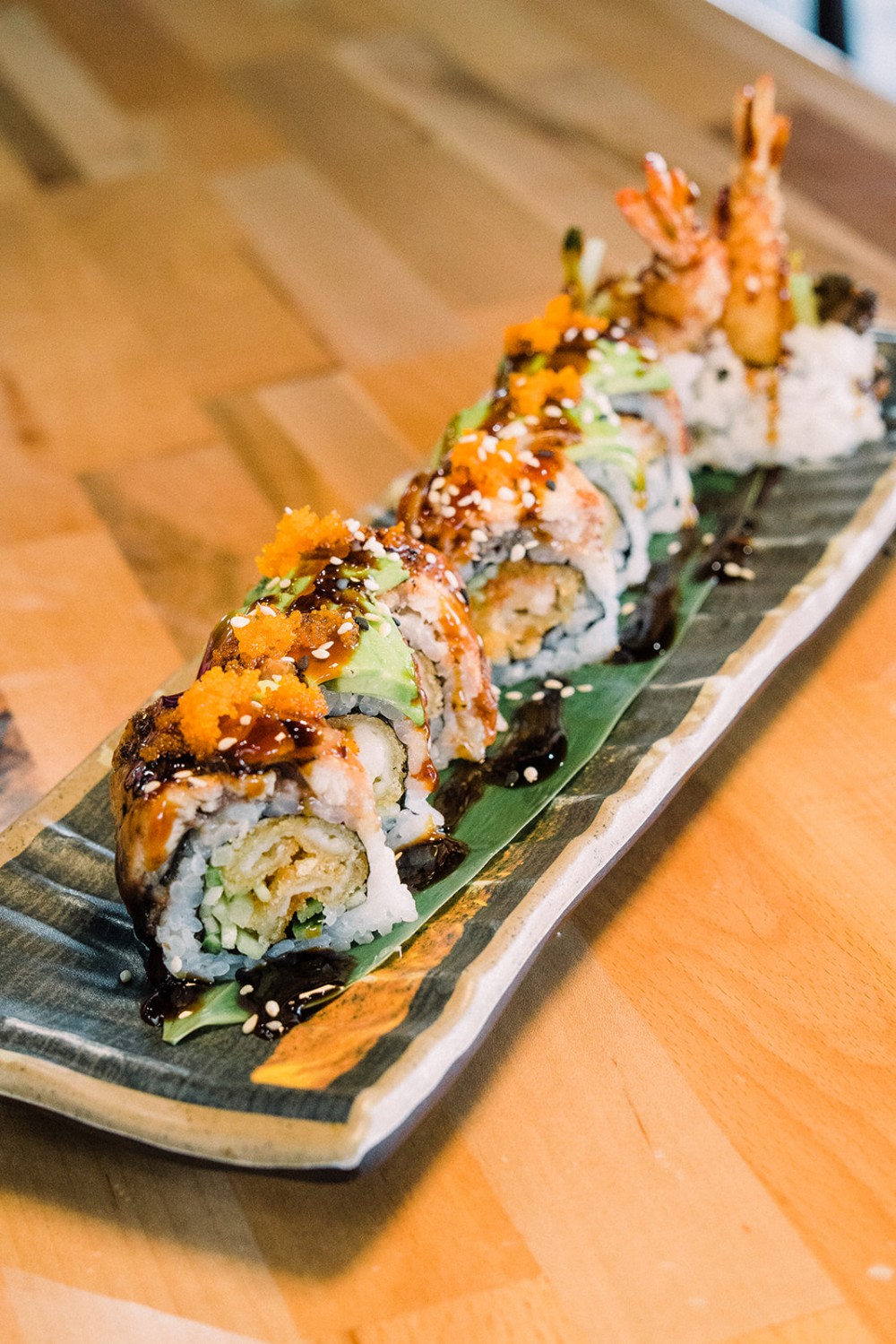 Tempura shrimp sushi roll with avocado and eel sauce