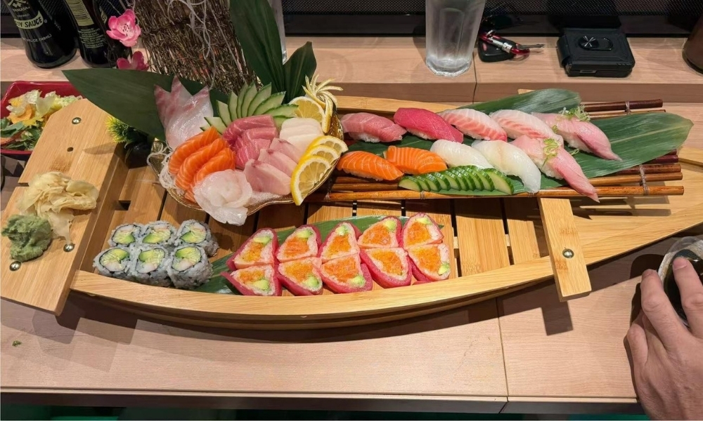 Assorted sushi on a boat - shaped plate at AKAMI Sushi & Grill,a Japanese Restaurant in Dawsonville