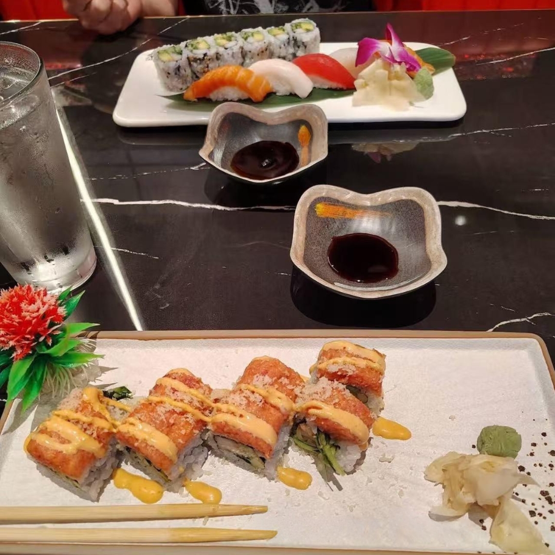 Sushi plates with rolls and sauce at AKAMI Sushi & Grill,a Japanese Restaurant in Dawsonville