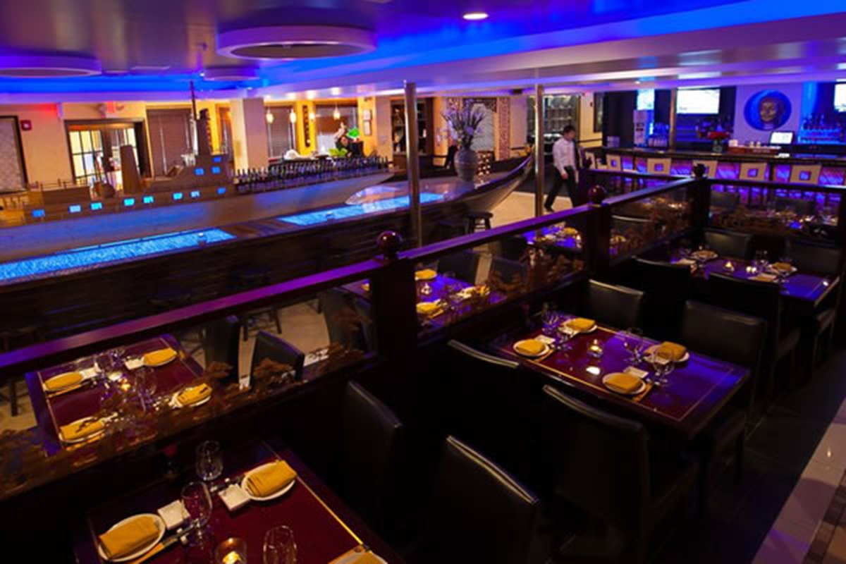 Modern bar lounge with blue lighting at Akira, a Japanese Restaurant in Glenmont