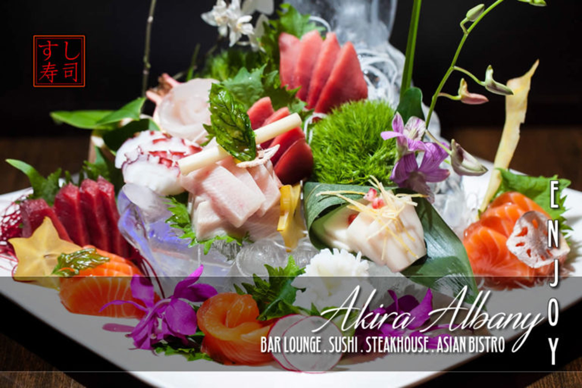 Fresh sashimi platter with orchid garnish at Akira, a Japanese Restaurant in Glenmont