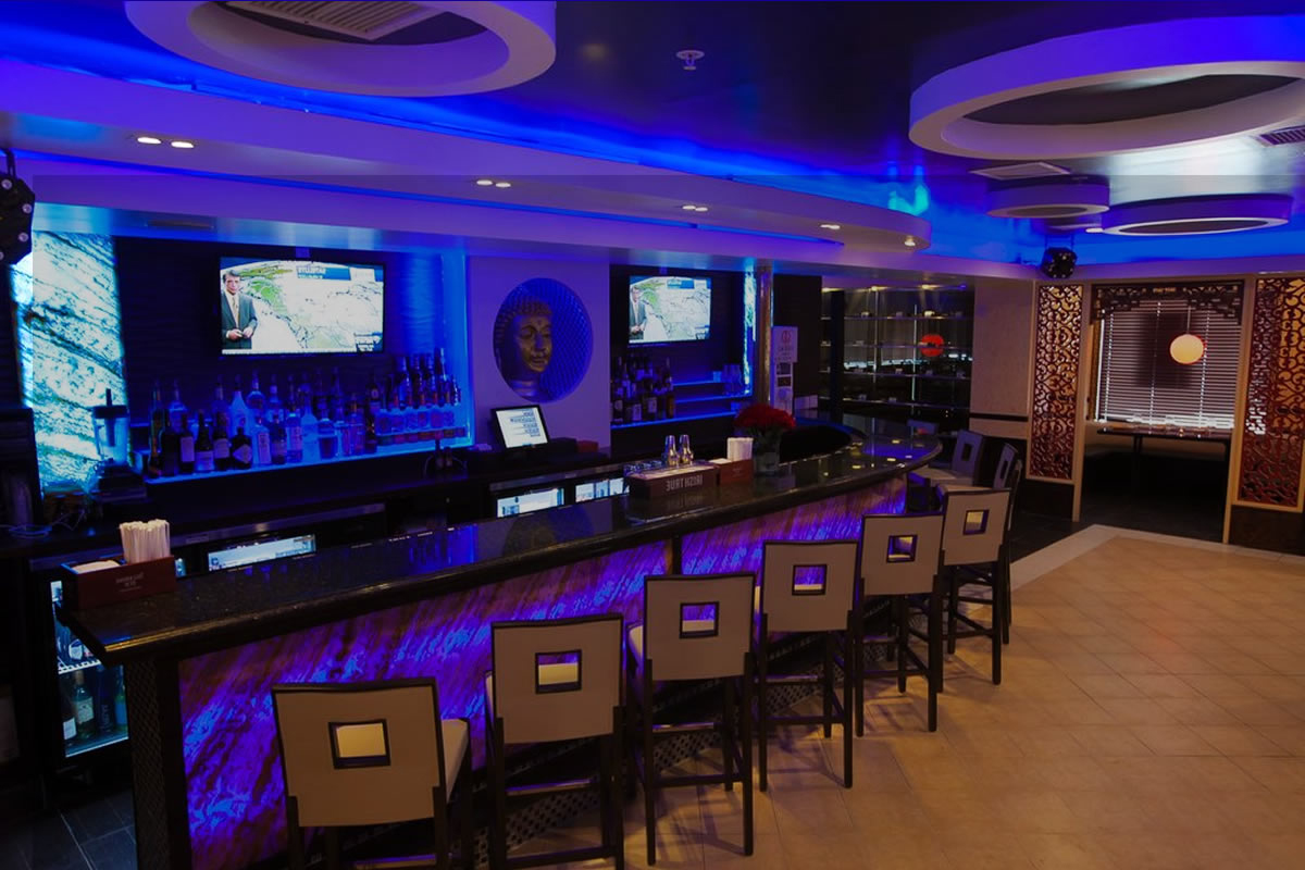 Blue lit sushi bar and lounge at Akira, a Japanese Restaurant in Glenmont