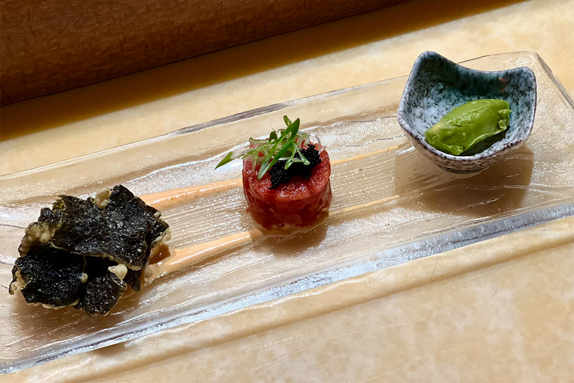 Tuna tartare appetizer with seaweed crisps and wasabi served on long clear glass tray at Aki Sushi & Asian Fusion, a Sushi Restaurant in Port Washington