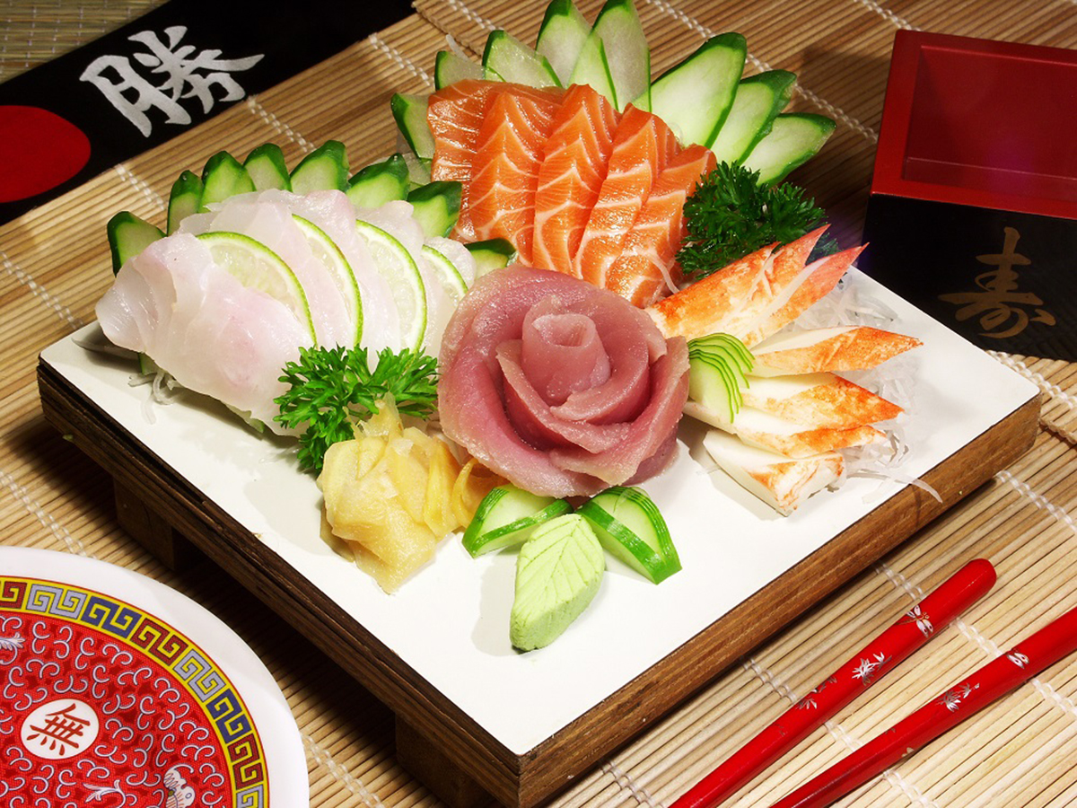 Artfully arranged sashimi platter shaped as tuna rose, garnished with cucumber and pickled ginger at Aki Sushi & Asian Fusion, a Sushi Restaurant in Port Washington